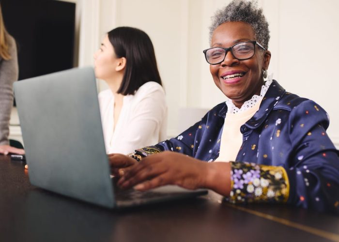 small portrait-of-cheerful-senior-black-businesswoman-2022-04-22-04-37-51-utc-min